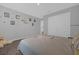 Comfortable bedroom with neutral tones, carpet floors, and ample closet space at 1240 Lone Palm Way, St Cloud, FL 34771