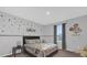 Whimsical bedroom with gray walls and Mickey Mouse decor at 1240 Lone Palm Way, St Cloud, FL 34771