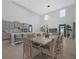 Well-lit dining area featuring modern finishes and a seamless flow to the kitchen at 1240 Lone Palm Way, St Cloud, FL 34771