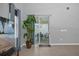View through glass patio door to backyard with outdoor table and chairs at 1240 Lone Palm Way, St Cloud, FL 34771