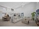 Open-concept living space with soaring ceilings and seamless flow to the kitchen at 1240 Lone Palm Way, St Cloud, FL 34771