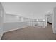 Spacious loft area with carpet flooring, offering versatile space for entertainment or relaxation at 1240 Lone Palm Way, St Cloud, FL 34771