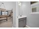 Convenient powder room featuring a vanity with a white countertop and access to the game room at 1240 Lone Palm Way, St Cloud, FL 34771