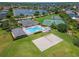 Aerial view of pool, tennis courts, and sand volleyball court for this community at 1270 Falling Star Ln, Orlando, FL 32828