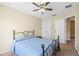 Bedroom featuring a ceiling fan, closet, and neutral paint at 1270 Falling Star Ln, Orlando, FL 32828
