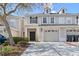 Exterior of townhome featuring garage, and entry way with door at 1270 Falling Star Ln, Orlando, FL 32828