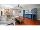 Comfortable living room featuring hardwood floors, modern furnishings and ample natural light at 1270 Falling Star Ln, Orlando, FL 32828