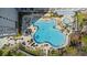 Overhead shot of the large community pool with ample seating and beautiful landscaping at 13415 Blue Heron Beach Dr # 610, Orlando, FL 32821