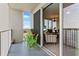 Relaxing balcony space with outdoor seating and a peek into the condo at 13415 Blue Heron Beach Dr # 610, Orlando, FL 32821
