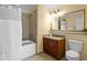 Neutral bathroom with a shower/tub combo, vanity, and toilet at 13415 Blue Heron Beach Dr # 610, Orlando, FL 32821