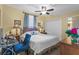 Comfortable bedroom with a large bed, neutral tones, a ceiling fan and cozy ambiance for restful nights at 13415 Blue Heron Beach Dr # 610, Orlando, FL 32821