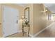 Inviting entryway with decorative mirror, table lamps, and tiled flooring, creating a warm and welcoming ambiance at 13415 Blue Heron Beach Dr # 610, Orlando, FL 32821