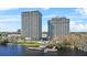 An exterior image of the condominiums showing a pier on the water with a seating area at 13415 Blue Heron Beach Dr # 610, Orlando, FL 32821