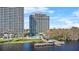 Condominium exterior near the water featuring a swimming pool and outdoor entertainment area at 13415 Blue Heron Beach Dr # 610, Orlando, FL 32821