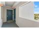 Hallway entry with a welcome mat and an EXIT sign at 13415 Blue Heron Beach Dr # 610, Orlando, FL 32821