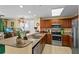 Well-equipped kitchen featuring stainless steel appliances, granite countertops and wood cabinets at 13415 Blue Heron Beach Dr # 610, Orlando, FL 32821