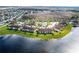 Aerial view of a condo community surrounded by water and lush greenery at 13801 Timberland Dr # 202, Orlando, FL 32824
