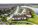 Aerial view of the neighborhood shows the community's layout, lake, and mature trees at 13801 Timberland Dr # 202, Orlando, FL 32824