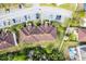A bird's eye view showing roof and parking areas, close proximity to neighbors and community landscaping at 13801 Timberland Dr # 202, Orlando, FL 32824