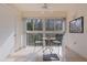 Cozy balcony with seating and views of nature and treeline at 13801 Timberland Dr # 202, Orlando, FL 32824