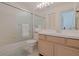 Clean bathroom showcasing a tub/shower combo with a glass enclosure and a single sink vanity at 13801 Timberland Dr # 202, Orlando, FL 32824