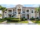 A well-kept townhome features reserved parking, two stories, and beautiful landscaping for an inviting curb appeal at 13801 Timberland Dr # 202, Orlando, FL 32824