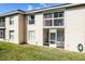 The exterior of the back of the building features a private screened-in porch area at 13801 Timberland Dr # 202, Orlando, FL 32824