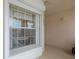 Exterior view of a condo's covered entryway with a window at 13801 Timberland Dr # 202, Orlando, FL 32824