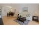Open-concept living area with hardwood floors and dining space beyond at 13801 Timberland Dr # 202, Orlando, FL 32824