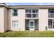 The exterior of the back patio features a private screened-in porch area at 13801 Timberland Dr # 202, Orlando, FL 32824