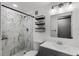 Bathroom featuring a tiled shower with new fixtures, modern vanity, and a decorative shelf at 144 Delespine Dr, Debary, FL 32713