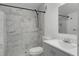 The bathroom is marbled and includes a glass walk-in shower with modern fixtures at 144 Delespine Dr, Debary, FL 32713