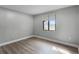 Cozy bedroom featuring a large window and modern flooring, perfect for relaxation at 144 Delespine Dr, Debary, FL 32713