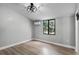 This bedroom is equipped with air conditioning, a ceiling fan, and modern vinyl floors at 144 Delespine Dr, Debary, FL 32713