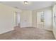 Carpeted bedroom featuring two doorways at 15088 Night Heron Dr, Winter Garden, FL 34787