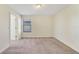 Empty bedroom features a window, neutral carpet and paint at 15088 Night Heron Dr, Winter Garden, FL 34787