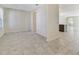 Bright, open-concept living area with neutral paint, tile flooring, and natural light from the window at 15088 Night Heron Dr, Winter Garden, FL 34787