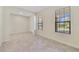 Bright living area with tile flooring, neutral walls and a large window bringing in natural light at 15088 Night Heron Dr, Winter Garden, FL 34787