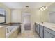 Bright bathroom featuring a soaking tub and double sink vanity at 15088 Night Heron Dr, Winter Garden, FL 34787