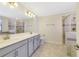 Updated bathroom with a glass-enclosed shower and double sink vanity at 15088 Night Heron Dr, Winter Garden, FL 34787