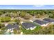 Aerial view of homes, lawns, and treed streets at 166 Marion Oaks Ln, Ocala, FL 34473