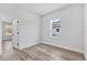 Bedroom featuring a window and wood-look flooring at 166 Marion Oaks Ln, Ocala, FL 34473