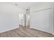 Bright bedroom featuring wood-look floors, closet and an ensuite bathroom at 166 Marion Oaks Ln, Ocala, FL 34473