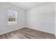 Sunlit bedroom featuring a window with views of the neighborhood at 166 Marion Oaks Ln, Ocala, FL 34473