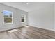 Light filled bedroom with two windows and wood-look floors at 166 Marion Oaks Ln, Ocala, FL 34473