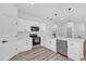 Modern kitchen features stainless steel appliances, white cabinets, and hard surface floors at 166 Marion Oaks Ln, Ocala, FL 34473