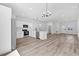 A stylish kitchen features stainless steel appliances, white cabinets, and pendant lighting at 166 Marion Oaks Ln, Ocala, FL 34473