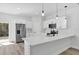 Modern kitchen with stainless steel appliances, white cabinets, and hard surface floors at 166 Marion Oaks Ln, Ocala, FL 34473