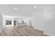 Open-concept living room, kitchen and dinning area with hard surface floors and recessed lighting at 166 Marion Oaks Ln, Ocala, FL 34473