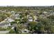 A high angle aerial view of a neighborhood with mature trees and well maintained lawns at 1701 Clouser Ave, Orlando, FL 32804